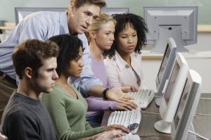 teacher at a computer tutor for good